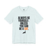 A light heather blue short-sleeve t-shirt with a graphic text print that reads 'ALWAYS BE YOURSELF. UNLESS YOU CAN BE A CAT.