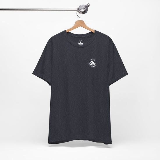 CATS, PERIOD. unisex cat tee front view highlighting minimalist chest logo on soft heather navy cotton on wood hanger