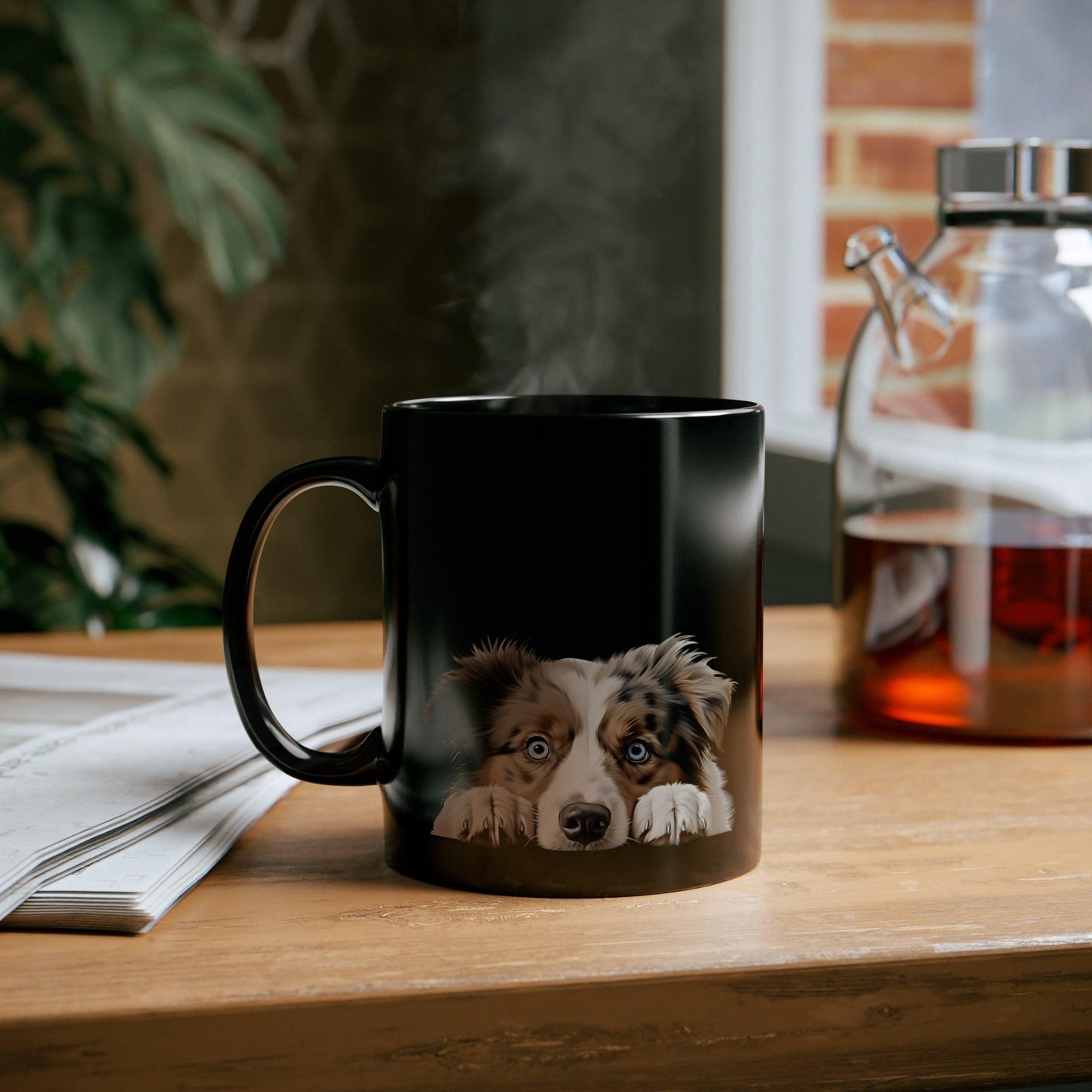 11 oz black ceramic dog mug with peeking Australian Shepherd design on office desk — perfect gift for dog mom, dog dad, or animal lovers.